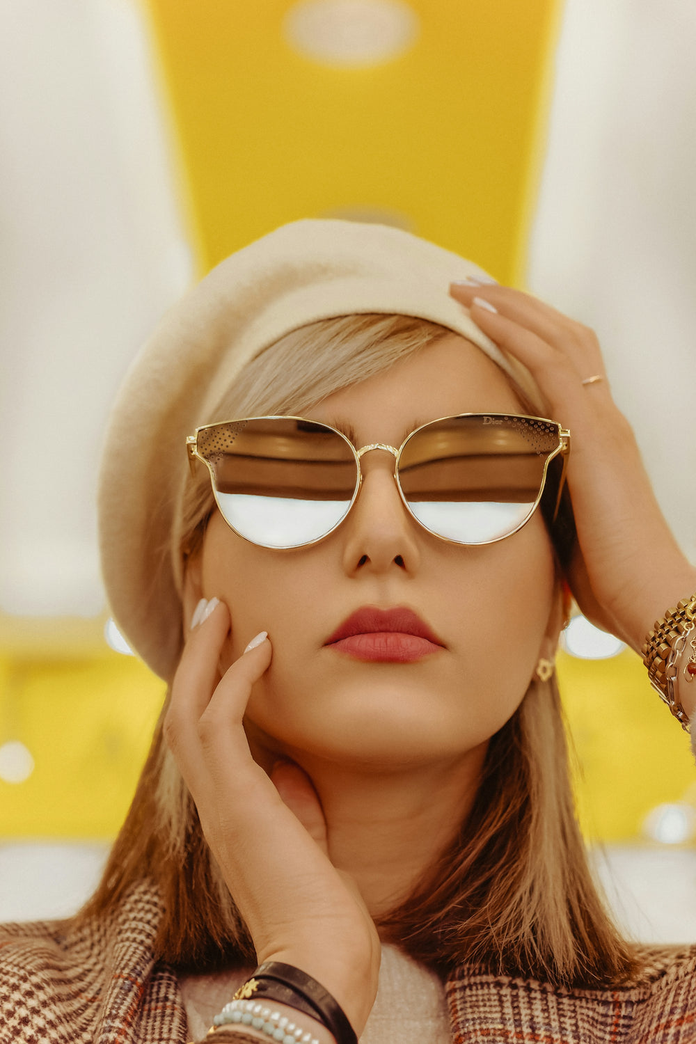 Woman wearing gold framed aviator sunglasses